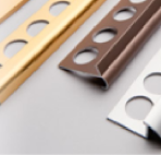 Metal tile edge trims in gold, brown, and silver colors
