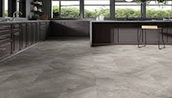 Modern kitchen with gray stone-look tile flooring